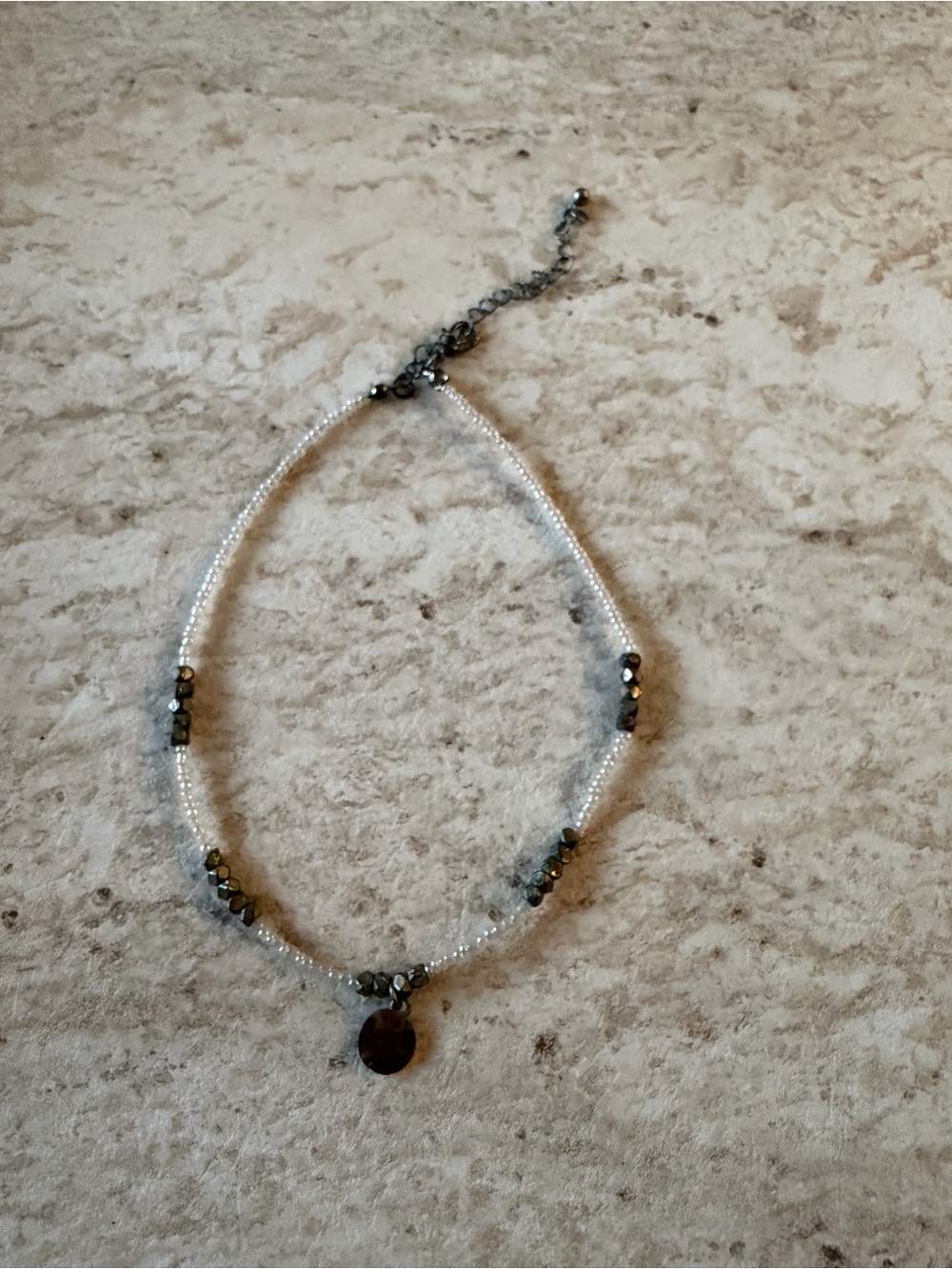 Delicate White Beaded Necklace with Gunmetal Accents and Disc Charm